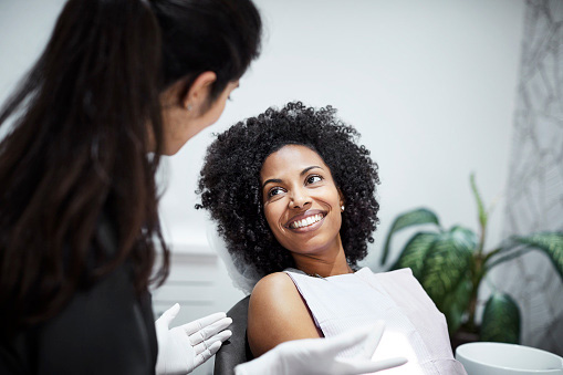 Image of a smiling woman at Martin Periodontics.