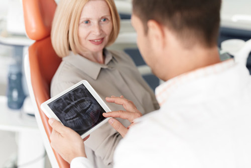 Patient with dentist at Martin Periodontics in Mason, OH
